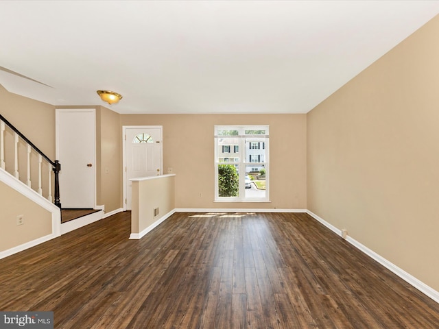 1851 Dulaney Ct, Frederick, MD 21702 - unfurnished living room with dark wood finished floors, baseboards, and stairway