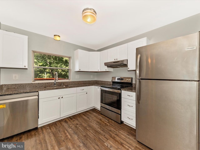 1851 Dulaney Ct, Frederick, MD 21702 - kitchen featuring appliances with stainless steel finishes, a sink, under cabinet range hood, white cabinetry, and dark wood-style flooring