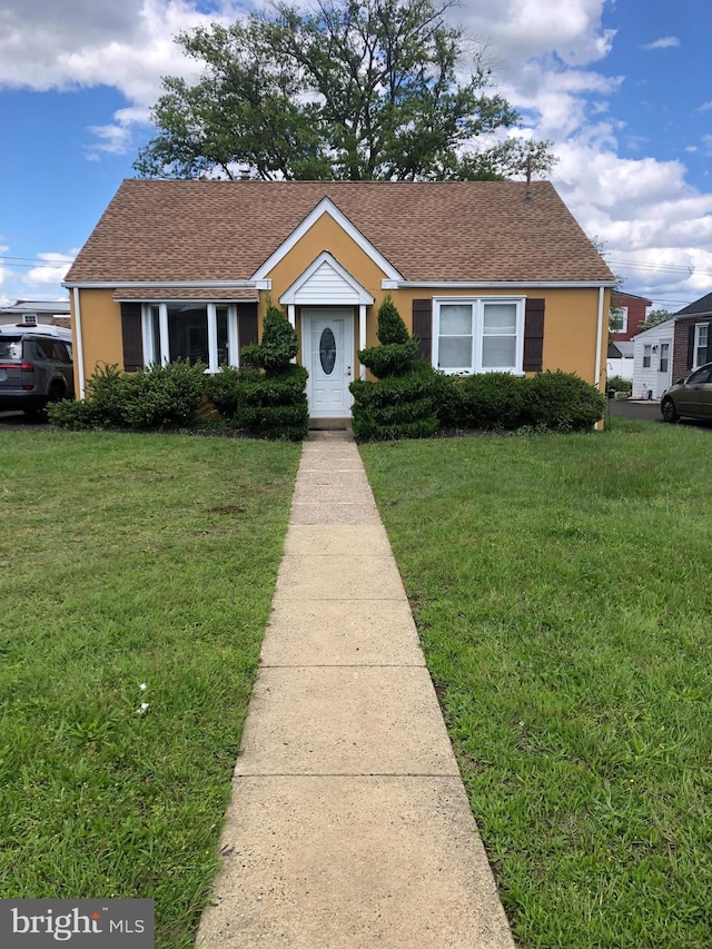 3149 Willits Rd, Philadelphia, PA 19114 - bungalow with a front yard, stucco siding, and a shingled roof