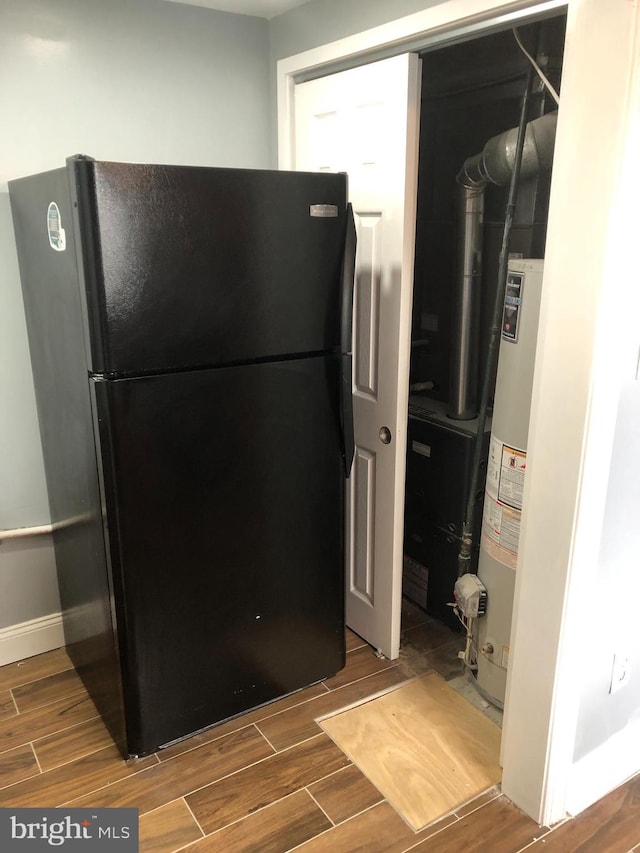 3149 Willits Rd, Philadelphia, PA 19114 - kitchen with freestanding refrigerator, wood tiled floors, water heater, and baseboards