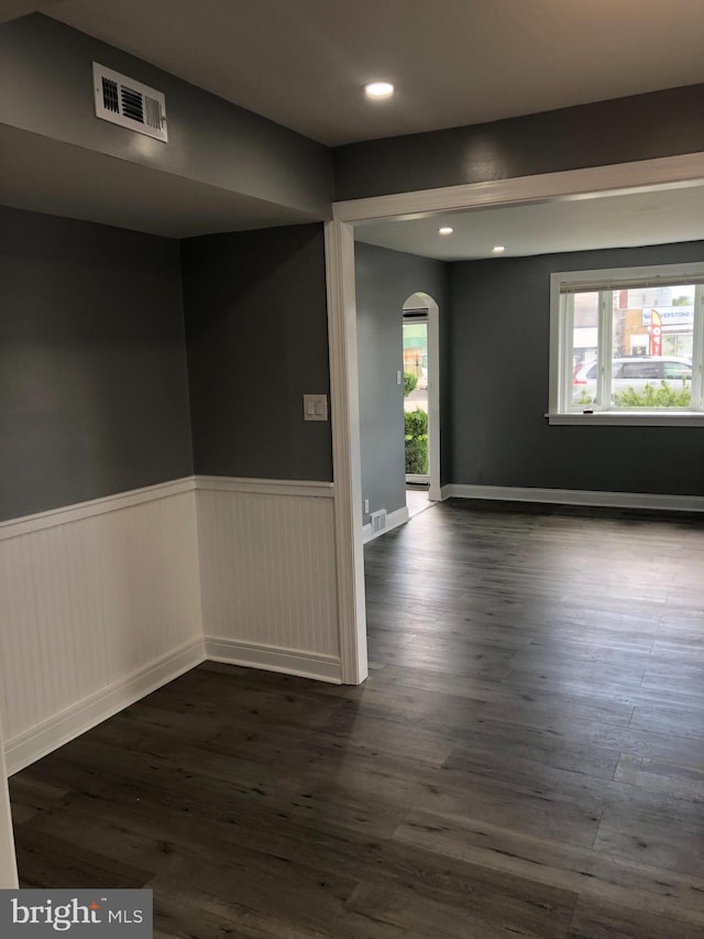 3149 Willits Rd, Philadelphia, PA 19114 - empty room with arched walkways, dark wood-type flooring, recessed lighting, and wainscoting