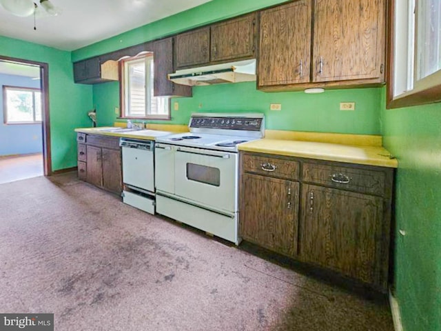 197 Coates Way, Fayette City, PA 15438 - kitchen featuring under cabinet range hood, white appliances, light countertops, light carpet, and a sink