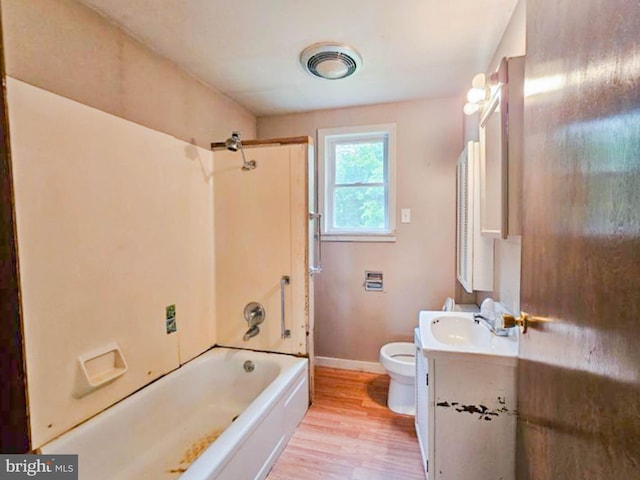 197 Coates Way, Fayette City, PA 15438 - full bathroom with toilet, vanity, wood finished floors, baseboards, and shower / bath combination