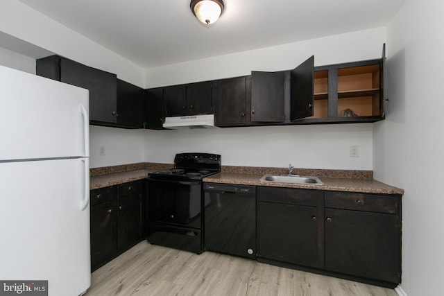 275 Green St Unit 4H5, Beverly, NJ 08010 - kitchen featuring black appliances, under cabinet range hood, a sink, and dark countertops