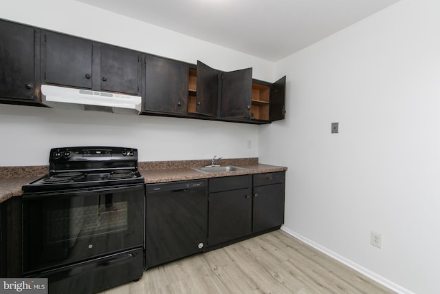 275 Green St Unit 4H5, Beverly, NJ 08010 - kitchen with black appliances, under cabinet range hood, light wood finished floors, a sink, and baseboards