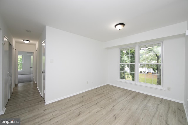 275 Green St Unit 4H5, Beverly, NJ 08010 - unfurnished room with light wood finished floors, baseboards, and a smoke detector