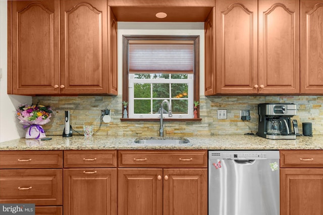 2332 Noel Cir, Pottstown, PA 19464 - kitchen with stainless steel dishwasher, a sink, tasteful backsplash, and light stone countertops