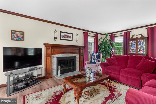 2332 Noel Cir, Pottstown, PA 19464 - living area featuring crown molding, wood finished floors, a fireplace, and baseboards