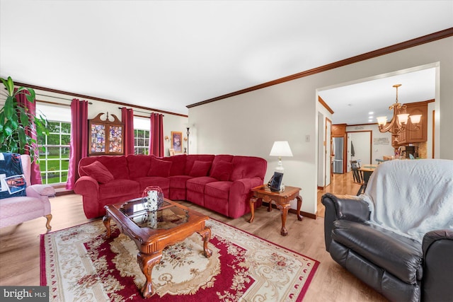 2332 Noel Cir, Pottstown, PA 19464 - living area featuring crown molding, a chandelier, wood finished floors, and baseboards