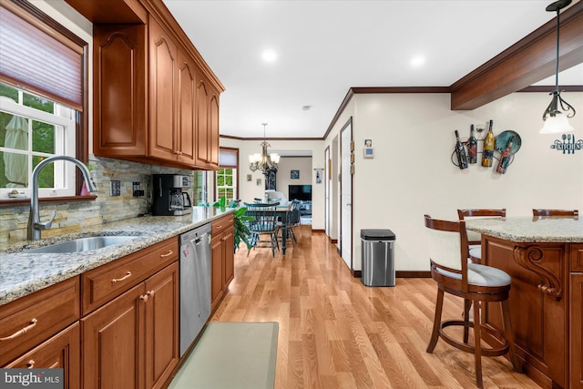 2332 Noel Cir, Pottstown, PA 19464 - kitchen with a sink, stainless steel dishwasher, tasteful backsplash, light wood-type flooring, and crown molding