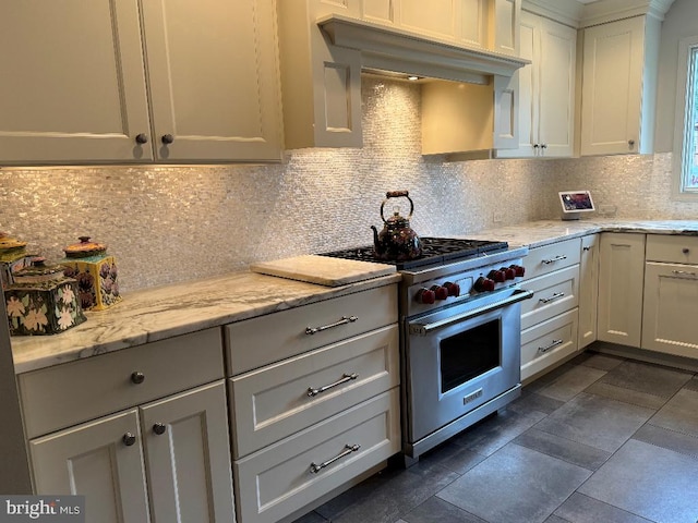 1041 Bobwhite Dr, Cherry Hill, NJ 08003 - kitchen featuring premium stove, tasteful backsplash, light stone countertops, and white cabinets