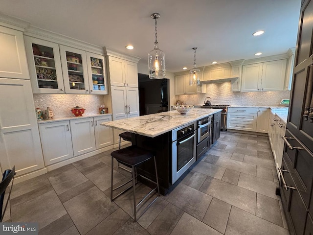 1041 Bobwhite Dr, Cherry Hill, NJ 08003 - kitchen featuring stainless steel oven, recessed lighting, backsplash, white cabinetry, and light stone counters