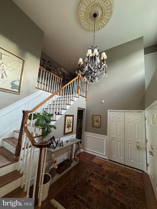 1041 Bobwhite Dr, Cherry Hill, NJ 08003 - staircase with a decorative wall, a chandelier, wainscoting, and wood finished floors