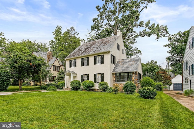 4405 Underwood Rd, Baltimore, MD 21218 - view of front of house with a front lawn, a high end roof, a chimney, and stone siding
