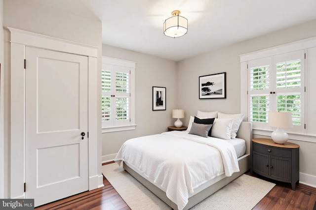4405 Underwood Rd, Baltimore, MD 21218 - bedroom with baseboards and dark wood-style flooring