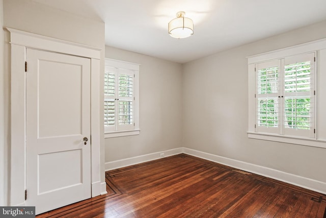 4405 Underwood Rd, Baltimore, MD 21218 - spare room with dark wood-type flooring and baseboards
