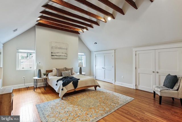 4405 Underwood Rd, Baltimore, MD 21218 - bedroom featuring light wood-type flooring, multiple closets, multiple windows, and baseboards