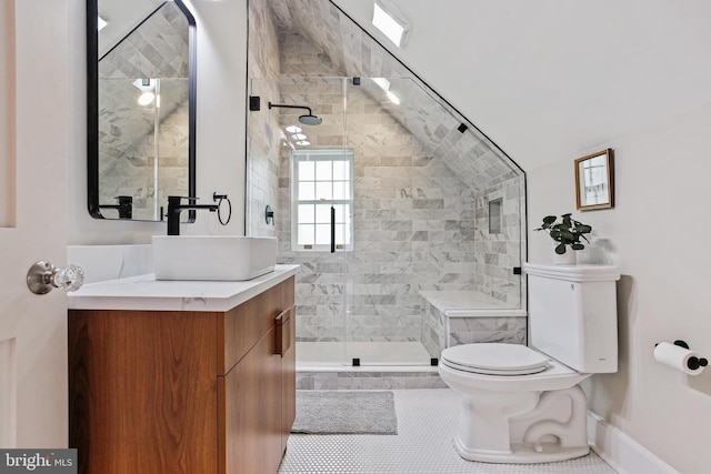 4405 Underwood Rd, Baltimore, MD 21218 - full bathroom featuring toilet, tile patterned floors, vanity, a shower stall, and vaulted ceiling