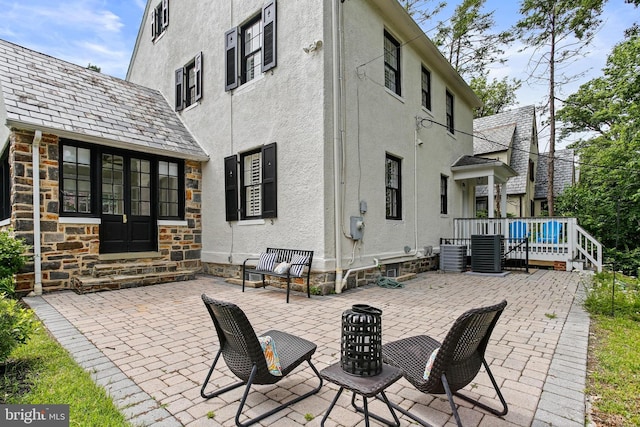 4405 Underwood Rd, Baltimore, MD 21218 - view of patio featuring entry steps, central air condition unit, and a deck