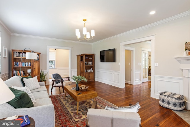 4405 Underwood Rd, Baltimore, MD 21218 - living room featuring hardwood / wood-style flooring, a chandelier, crown molding, and wainscoting