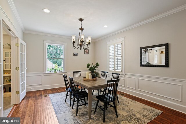 4405 Underwood Rd, Baltimore, MD 21218 - dining space featuring a chandelier, ornamental molding, wood finished floors, a wainscoted wall, and recessed lighting