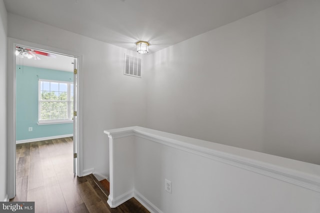 44138 Allderwood Ter, Ashburn, VA 20147 - hall with an upstairs landing, dark wood-type flooring, and baseboards