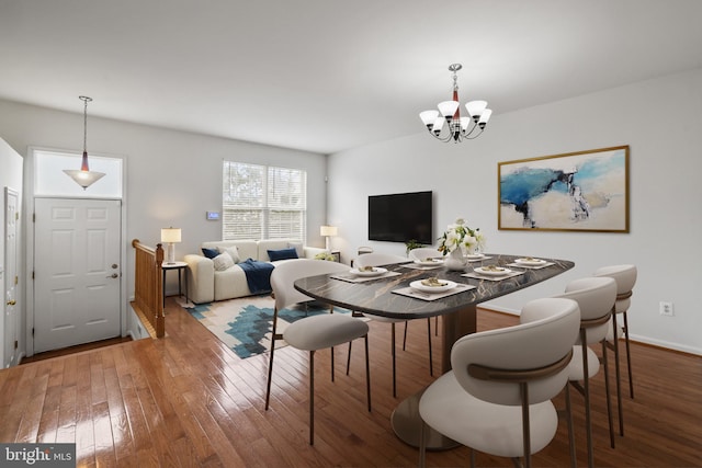 44138 Allderwood Ter, Ashburn, VA 20147 - dining room featuring hardwood / wood-style floors, a chandelier, and baseboards