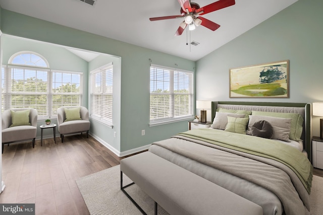 44138 Allderwood Ter, Ashburn, VA 20147 - bedroom with vaulted ceiling, multiple windows, wood finished floors, baseboards, and a ceiling fan
