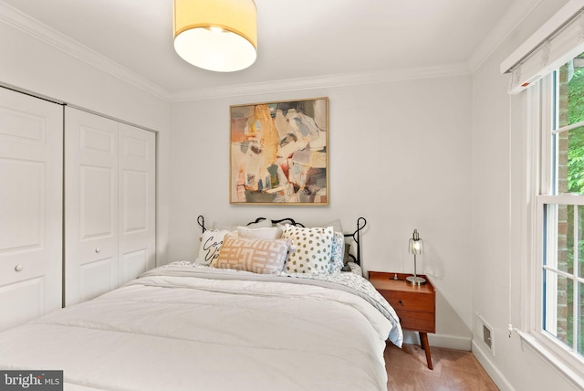 2455 Alsop Ct, Reston, VA 20191 - carpeted bedroom featuring crown molding, a closet, and baseboards