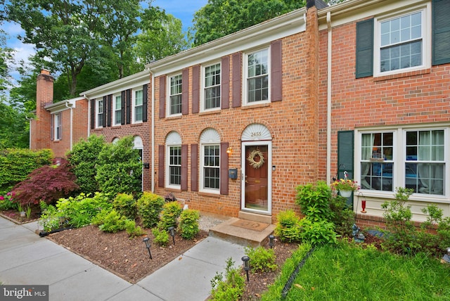 2455 Alsop Ct, Reston, VA 20191 - view of front of house with brick siding and a chimney