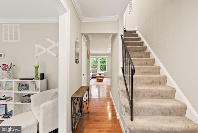 2455 Alsop Ct, Reston, VA 20191 - stairway featuring wood finished floors, crown molding, and baseboards