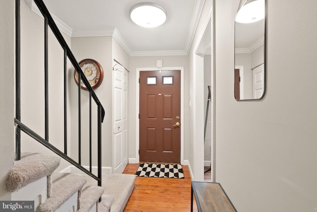 2455 Alsop Ct, Reston, VA 20191 - foyer featuring light wood finished floors, stairs, ornamental molding, and baseboards