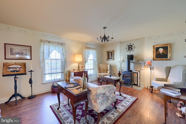 2 Kings Ct, Gordonville, PA 17529 - living room with a wood stove, wood-type flooring, a chandelier, and baseboards