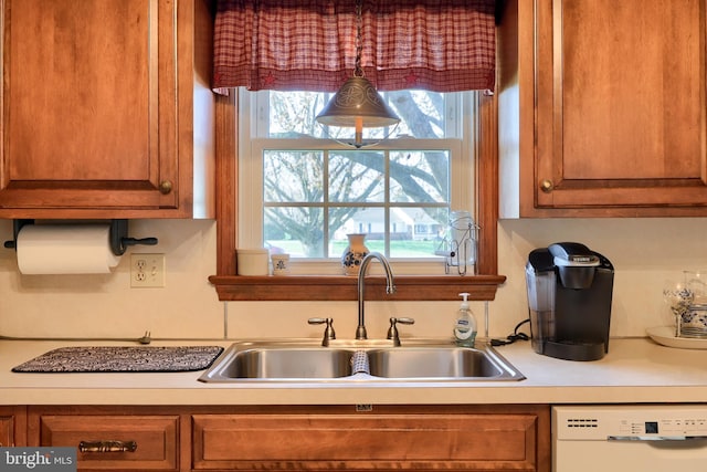 2 Kings Ct, Gordonville, PA 17529 - kitchen with dishwasher, a sink, brown cabinetry, and light countertops