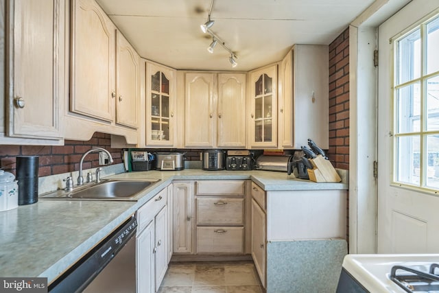 2609 E Monmouth St, Philadelphia, PA 19134 - kitchen featuring a sink, dishwasher, light brown cabinets, light countertops, and glass insert cabinets
