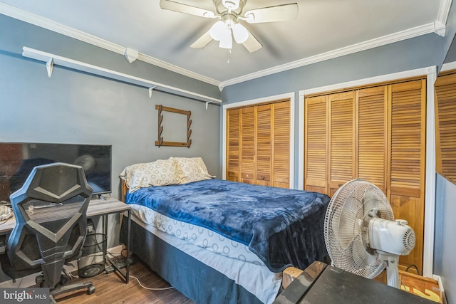 2609 E Monmouth St, Philadelphia, PA 19134 - bedroom with two closets, ornamental molding, wood finished floors, and a ceiling fan