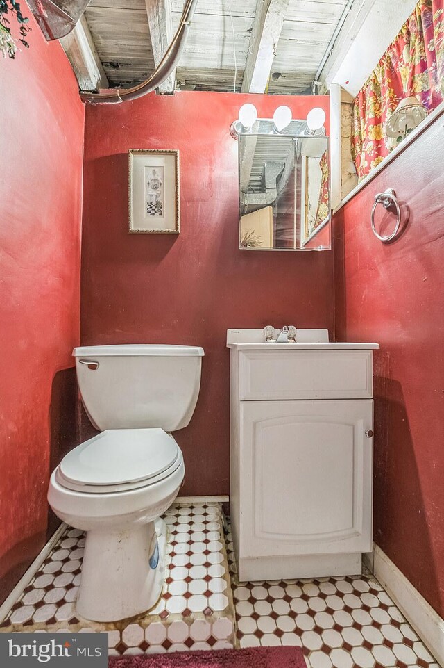 2609 E Monmouth St, Philadelphia, PA 19134 - bathroom with toilet, vanity, and baseboards