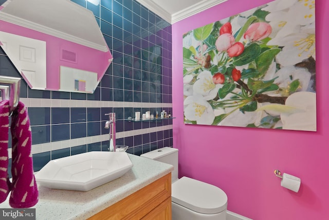 116 Cameron Mews, Alexandria, VA 22314 - bathroom with toilet, tile walls, ornamental molding, and vanity