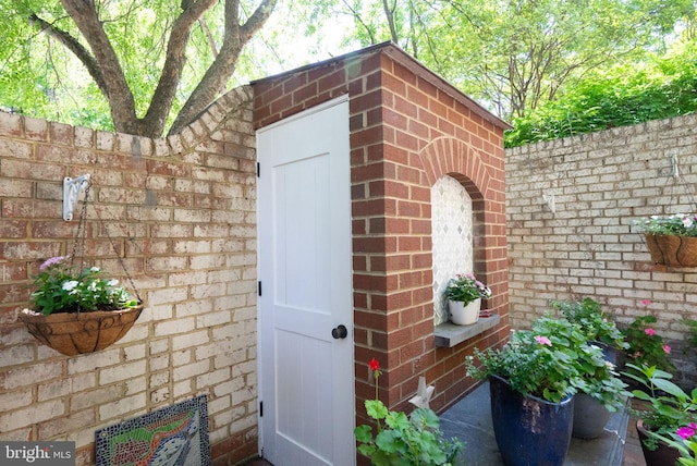 116 Cameron Mews, Alexandria, VA 22314 - doorway to property featuring brick siding