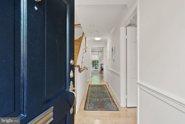 116 Cameron Mews, Alexandria, VA 22314 - corridor featuring light wood-style floors, stairway, and ornamental molding