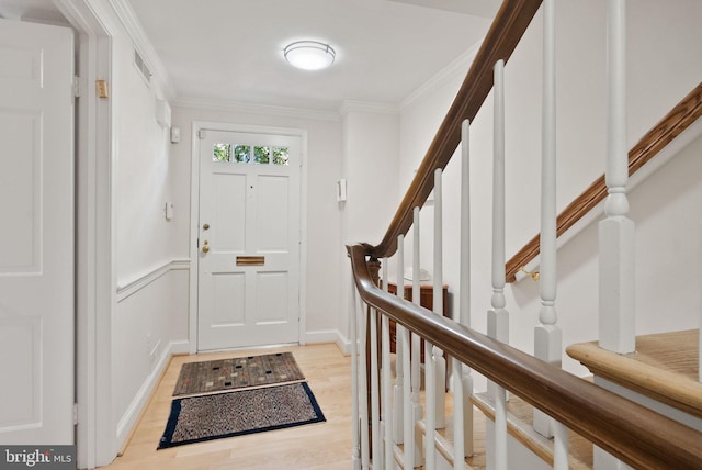 116 Cameron Mews, Alexandria, VA 22314 - foyer featuring stairway, light wood finished floors, and crown molding