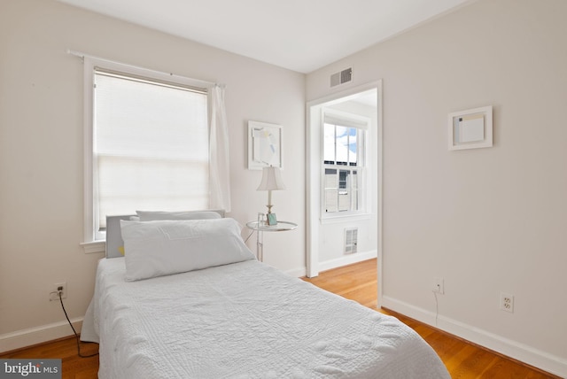 116 Cameron Mews, Alexandria, VA 22314 - bedroom featuring light wood-style floors and baseboards