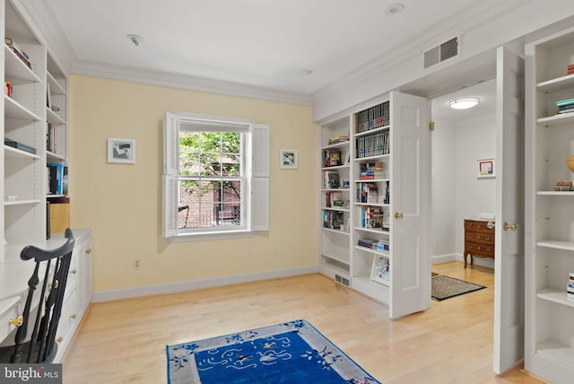 116 Cameron Mews, Alexandria, VA 22314 - living area with light wood-style flooring, ornamental molding, and baseboards