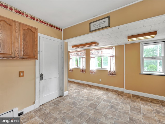 9 S Stanton St, Schuylkill Haven, PA 17972 - unfurnished room with a baseboard heating unit, baseboards, and stone finish floors