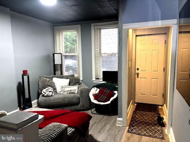 744 Cherry St, Camden, NJ 08103 - living area featuring wood finished floors and baseboards