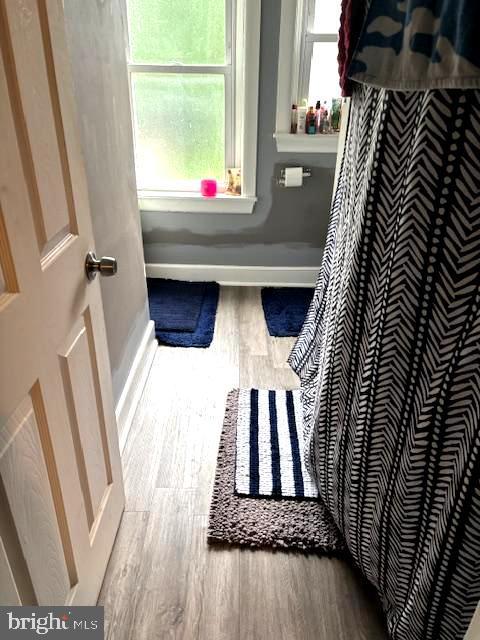744 Cherry St, Camden, NJ 08103 - bathroom with wood finished floors, healthy amount of natural light, and baseboards