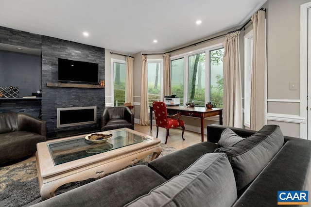 15 Trillium Close, Wintergreen Resort, VA 22967 - living area with a stone fireplace, wood finished floors, and recessed lighting