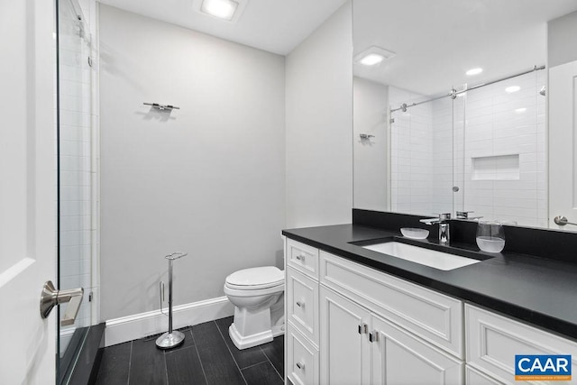 15 Trillium Close, Wintergreen Resort, VA 22967 - bathroom featuring vanity, toilet, tiled shower, and baseboards