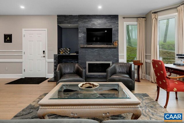 15 Trillium Close, Wintergreen Resort, VA 22967 - living room with a stone fireplace, wood finished floors, and recessed lighting