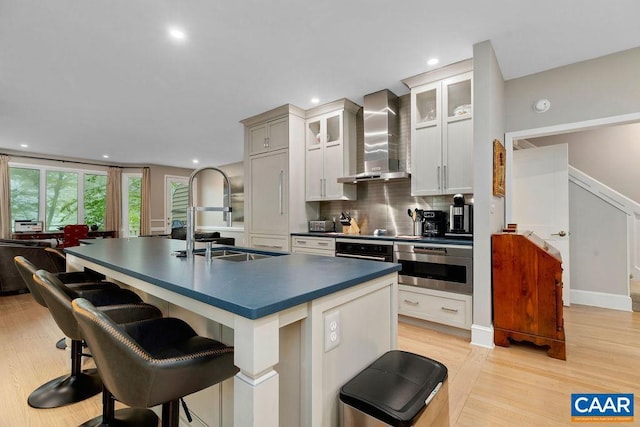 15 Trillium Close, Wintergreen Resort, VA 22967 - kitchen with oven, wall chimney range hood, a sink, dark countertops, and recessed lighting